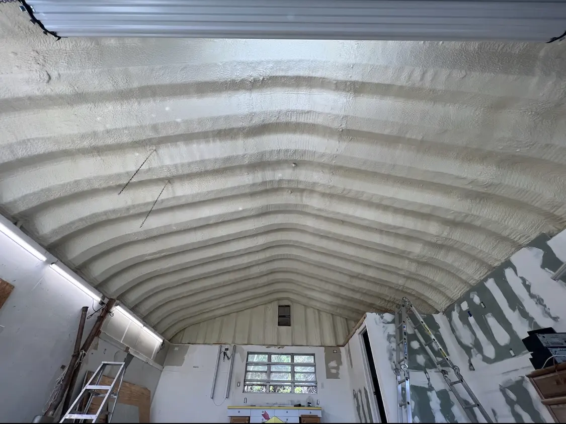 Spray polyurethane foam applied to the underside of a metal roof deck in Montevallo